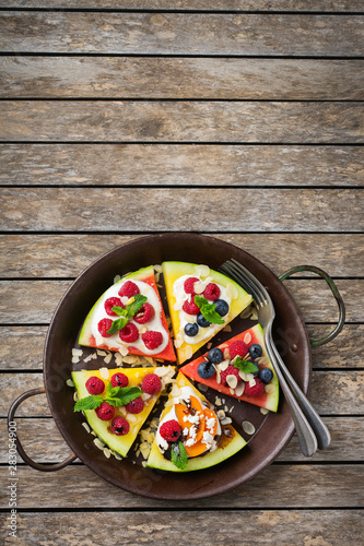 Watermelon pizza with berries, fruits, yogurt, feta cheese