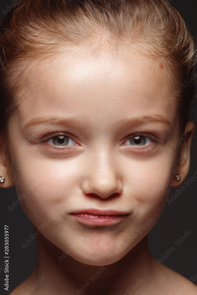 Close up portrait of little and emotional caucasian girl. Highly detail photoshot of female model with well-kept skin and bright facial expression. Concept of human emotions. Thoughtful, thinking.