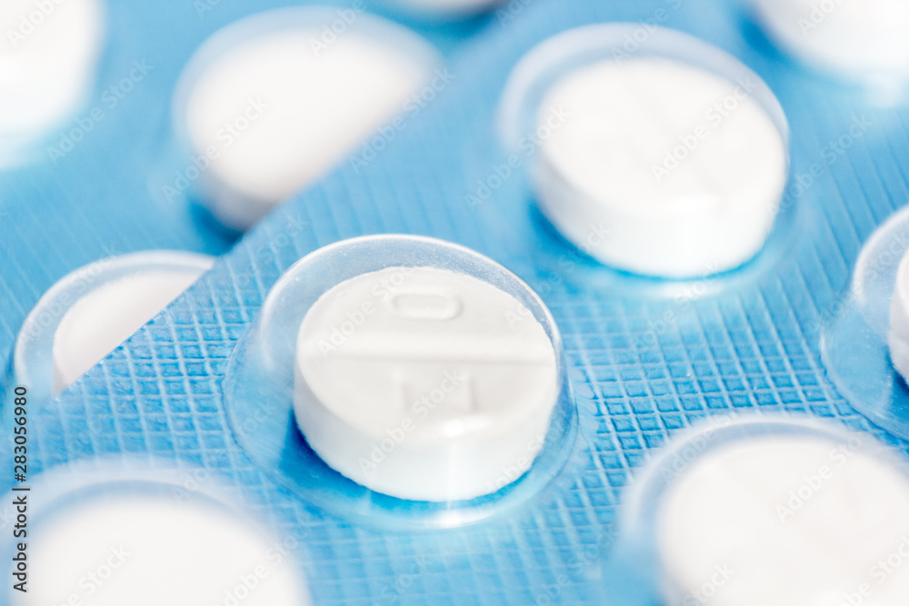 pills inside of blue tablet isolated pills inside of blue tablet isolated