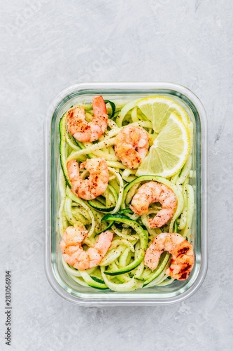 Meal prep lunch box containers Spiralized zucchini noodles pasta with shrimps