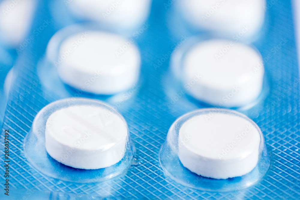 pills inside of blue tablet isolated pills inside of blue tablet isolated