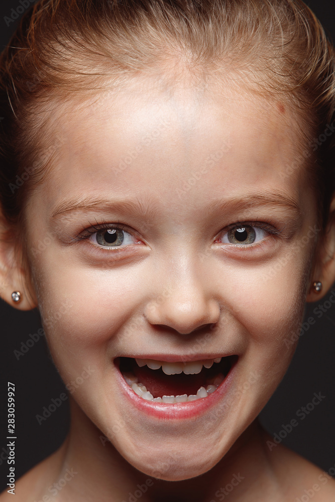 Close up portrait of little and emotional caucasian girl. Highly detail photoshot of female model with well-kept skin and bright facial expression. Concept of human emotions. Smiling, laughting. Close up portrait of little and emotional caucasian girl. Highly detail photoshot of female model with well-kept skin and bright facial expression. Concept of human emotions. Smiling, laughting.