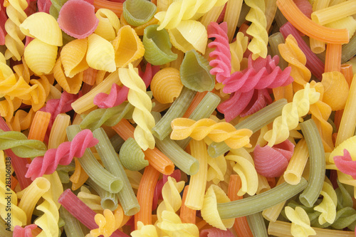 Mixed colorful pasta as background