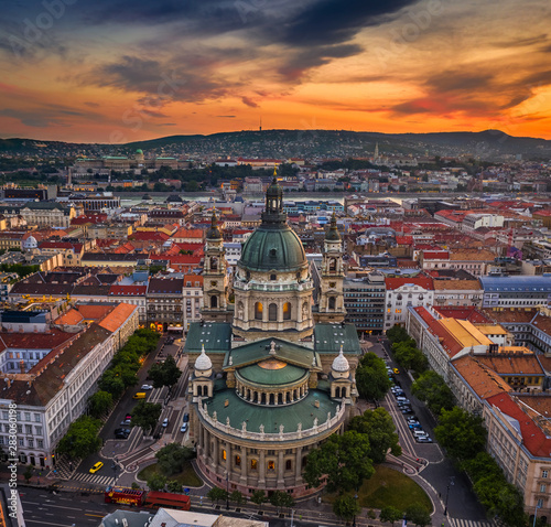 Budapest, Hungary - Aerial skyline view of Budapest at sunset with St.Stephen's Basilica. Buda Castle Royal Palace, Szechenyi Chain Bridge and Fisherman's Bastion background with golden sky