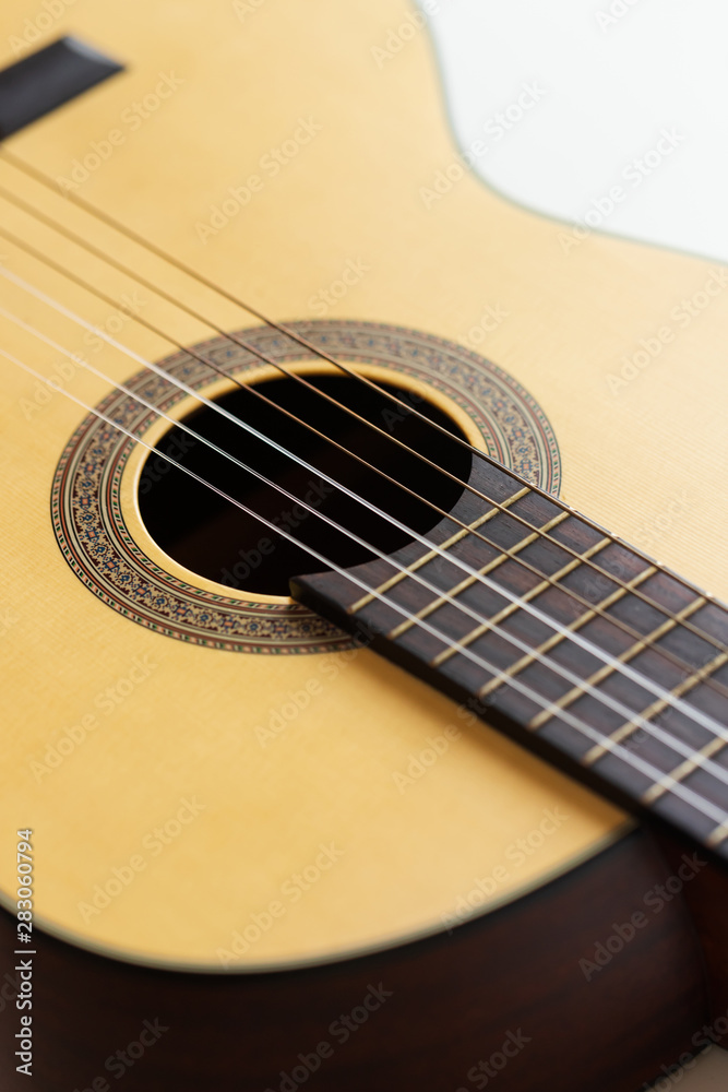 Close-up Wooden Spanish classic guitar with nylon string select focus shallow depth of field Close-up Wooden Spanish classic guitar with nylon string select focus shallow depth of field