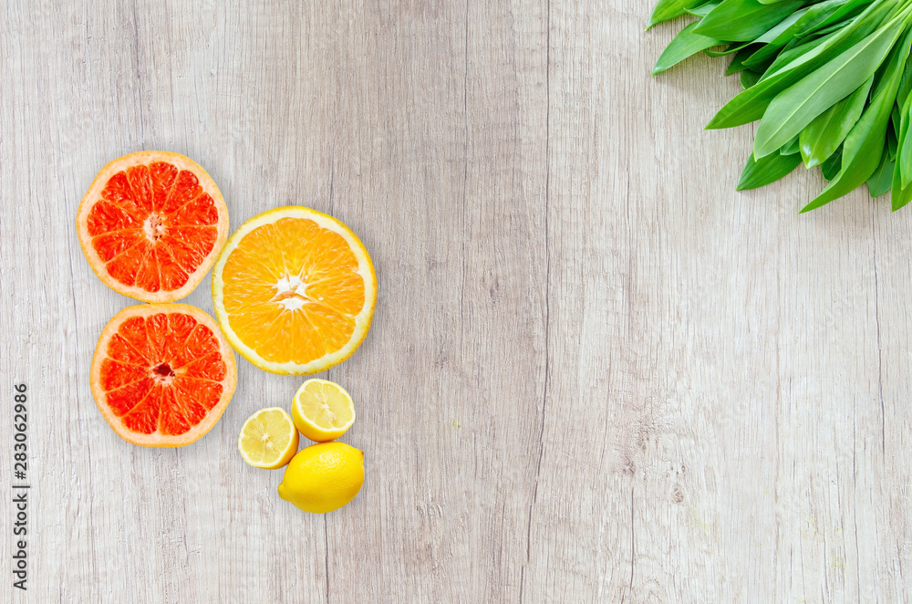 Pulpy fruits placed on the wooden table. Food frame with leaves and juicy things. Orange and lemon garnished on wood. Pulpy fruits placed on the wooden table. Food frame with leaves and juicy things. Orange and lemon garnished on wood.