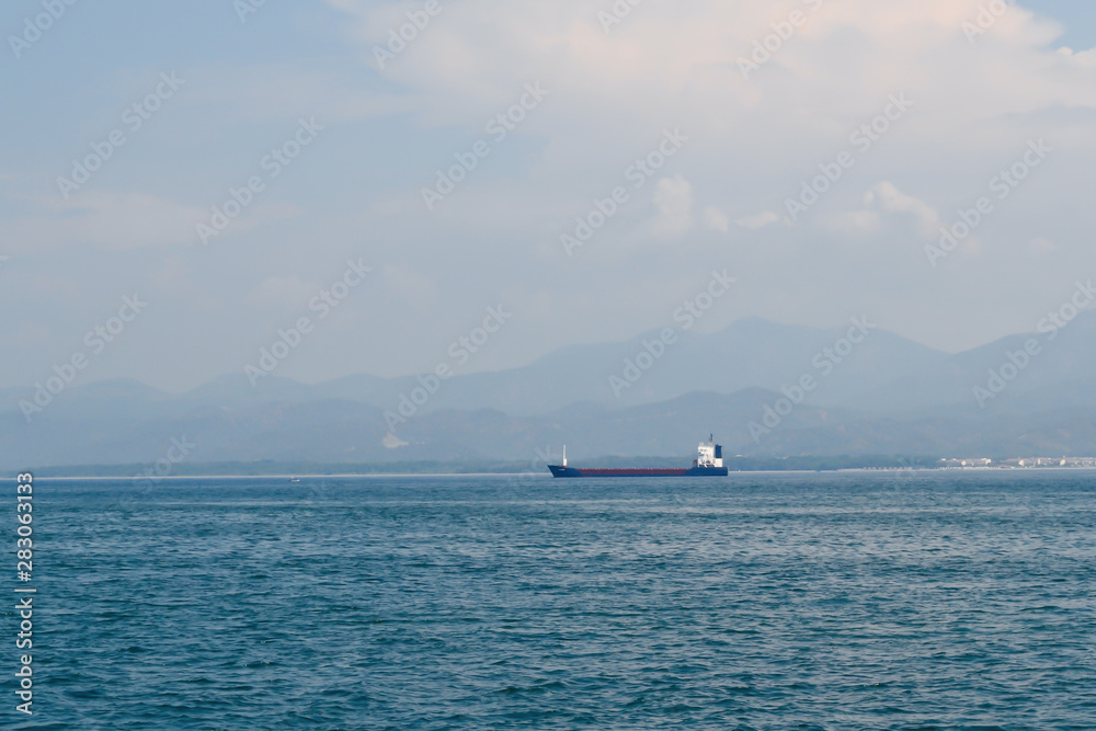 Large cargo ship in the Mediterranean Sea off the Turkish coast Large cargo ship in the Mediterranean Sea off the Turkish coast