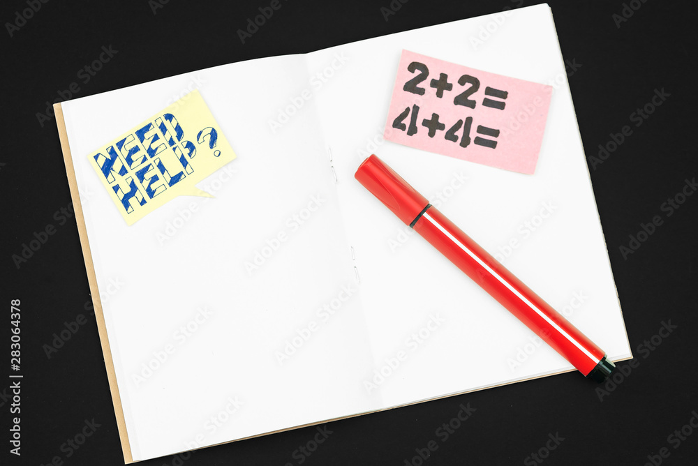 Notepad and marker on black background Notepad and marker on black background