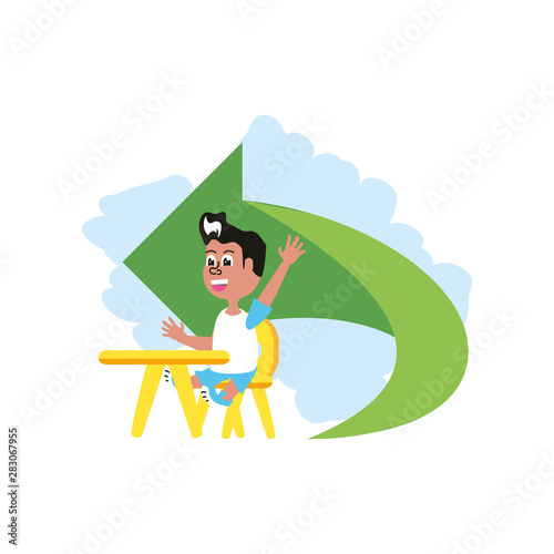 little student boy sitting in school desk with arrow
