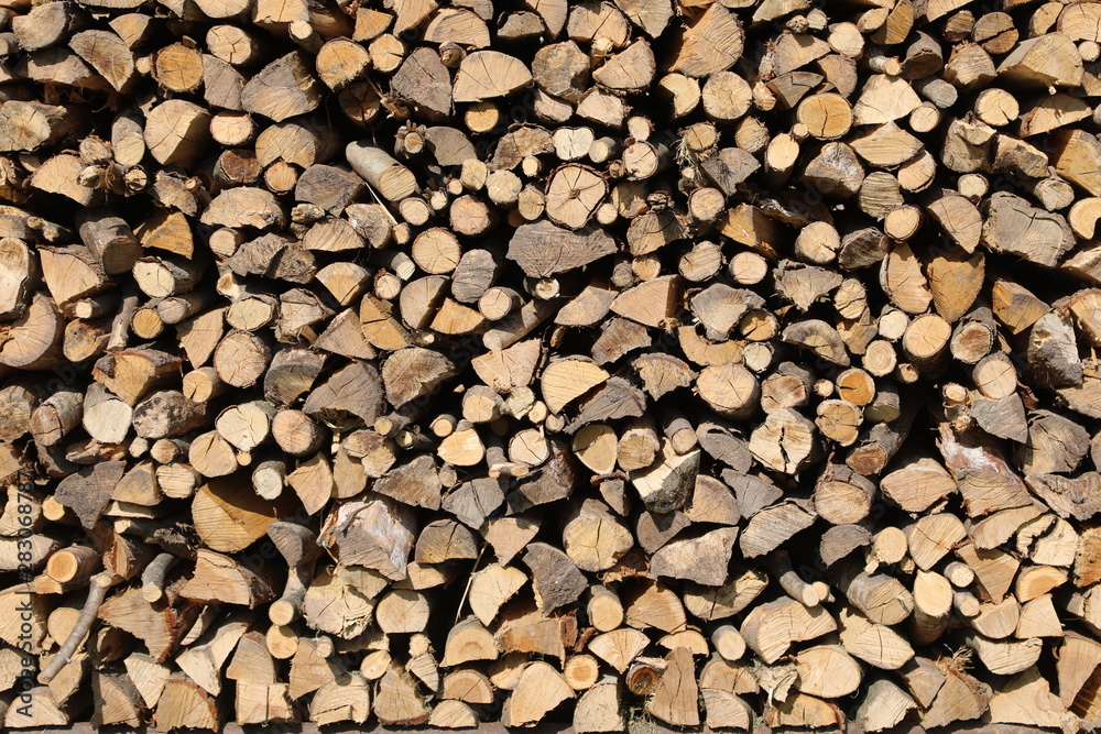 background of many wooden logs in the woodshed background of many wooden logs in the woodshed