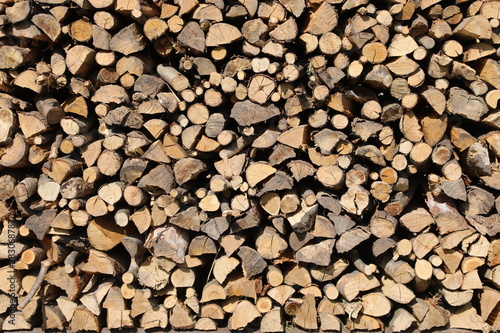 background of many wooden logs in the woodshed