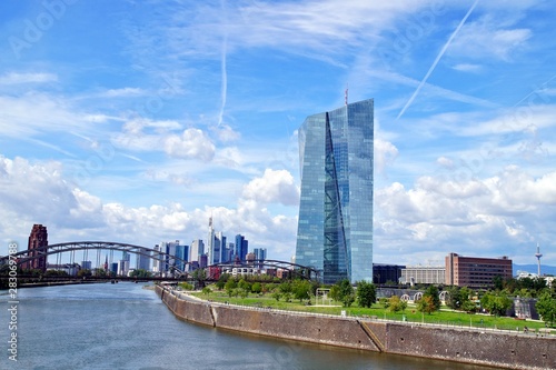 view of the river Main with the headquarters of ECB and the skyline of Frankfurt. European Central Bank and Skyscraper buildings in Germany with blue sky background. Business and finance concept photo