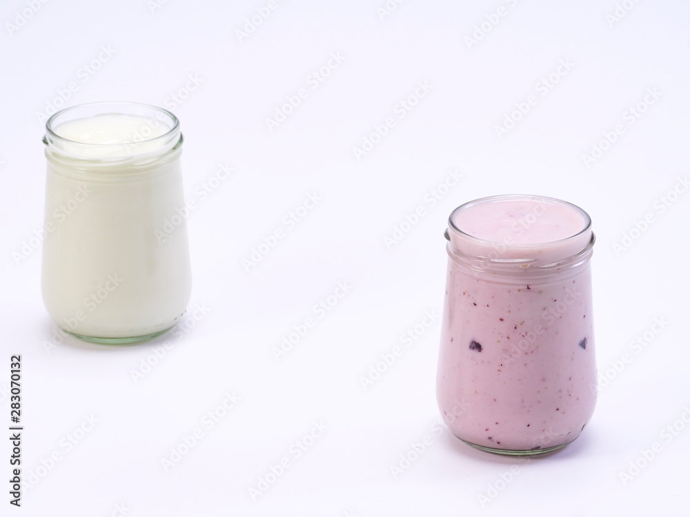 Fresh blueberry yogurt glass on a white background