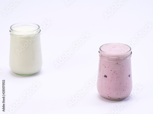 Fresh blueberry yogurt glass on a white background