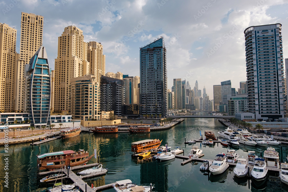 Dubai marina with boats and buildings, United Arab Emirates