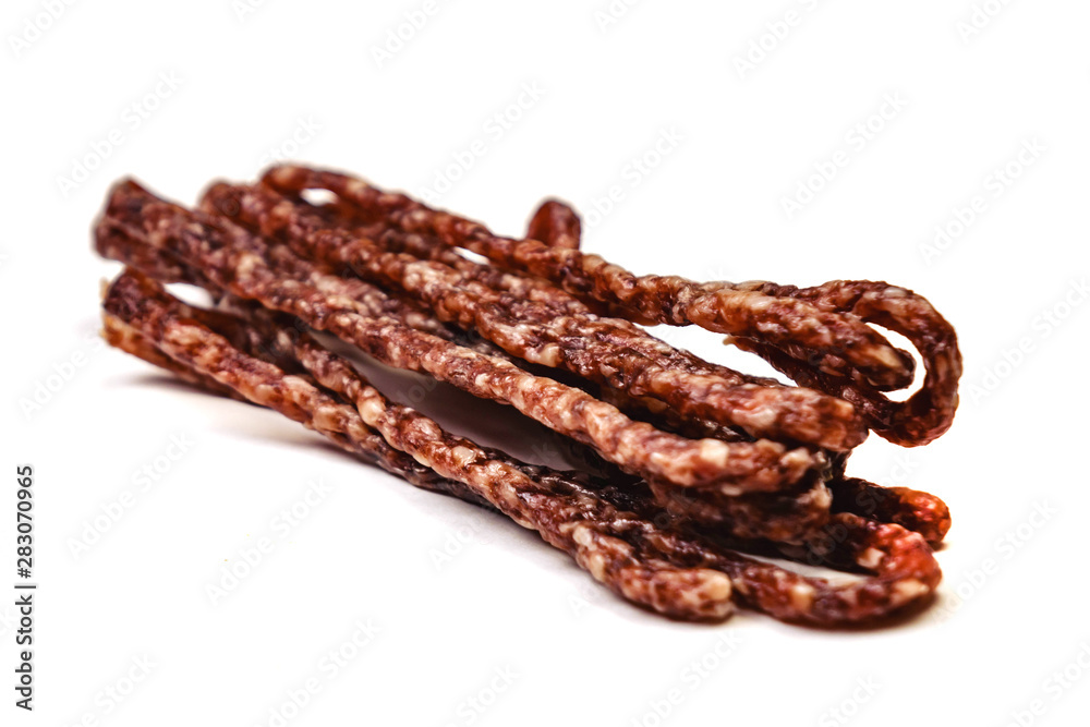 Small smoked sausage with spice isolated on white background Small smoked sausage with spice isolated on white background