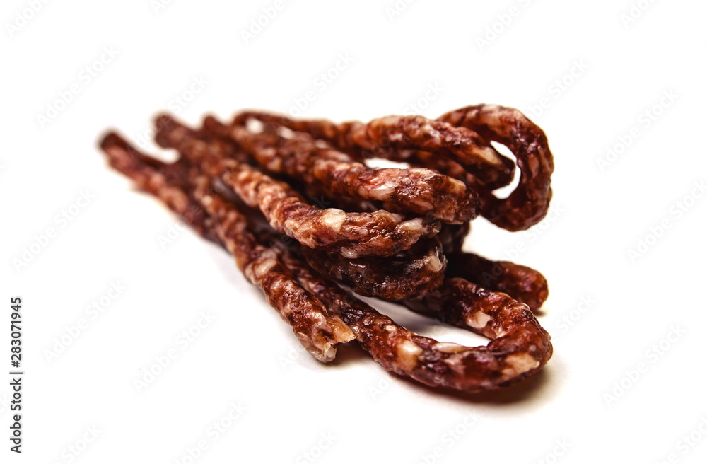 Small smoked sausage with spice isolated on white background Small smoked sausage with spice isolated on white background