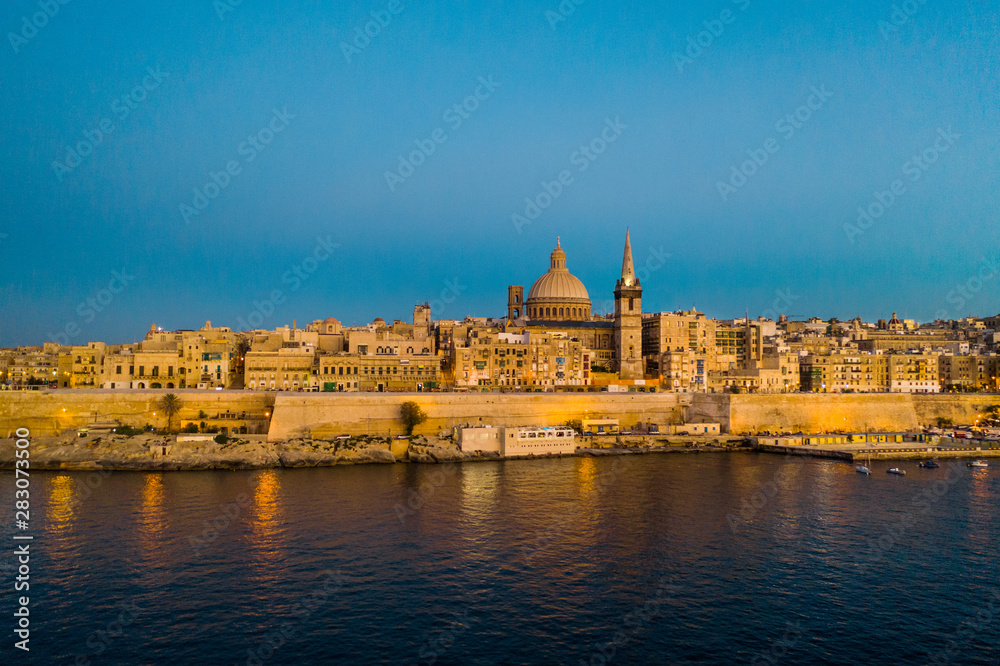 Valletta city. Aerial view of Valletta Skyline in the evening, Sunset. Blue sky. Malta
