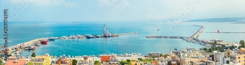 Industrial port or harbor with container or cargo ships and cranes in iskenderun seaport at Hatay city of Turkey. Transportation and logistic at Mediterranean sea.  photo