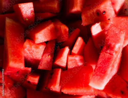 Many sliced ​​red watermelons, background