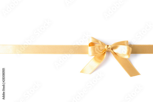 Golden ribbon with bow isolated on white background. Gift concept