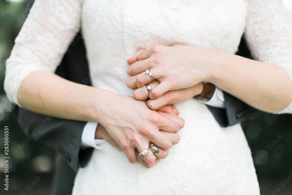 bride and groom interlocking fingers bride and groom interlocking fingers