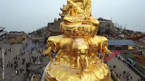 Golden buddha at mount emei. Statue of Samantabhadra. Sichuan, China (aerial photography) photo