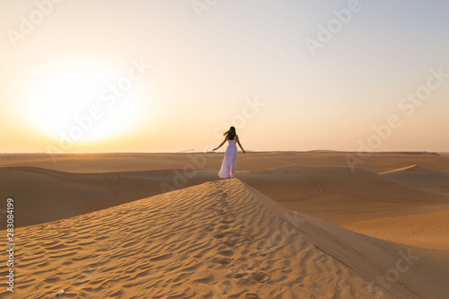 UAE. Woman in desert