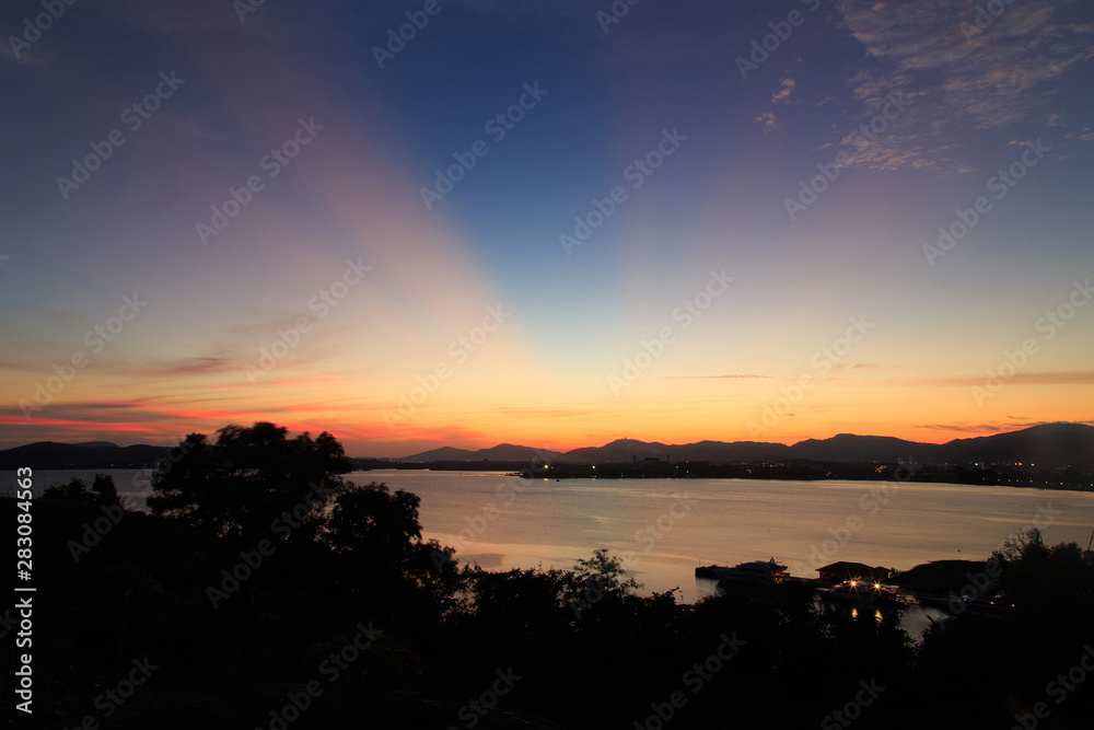 Vibrant and colorful purple sunset with silhouette of mountains/Colorful sunset behind mountains of tropical island/Sky after sunset a beautiful colorful/Beautiful twilight sky and landscape/ Vibrant and colorful purple sunset with silhouette of mountains/Colorful sunset behind mountains of tropical island/Sky after sunset a beautiful colorful/Beautiful twilight sky and landscape/