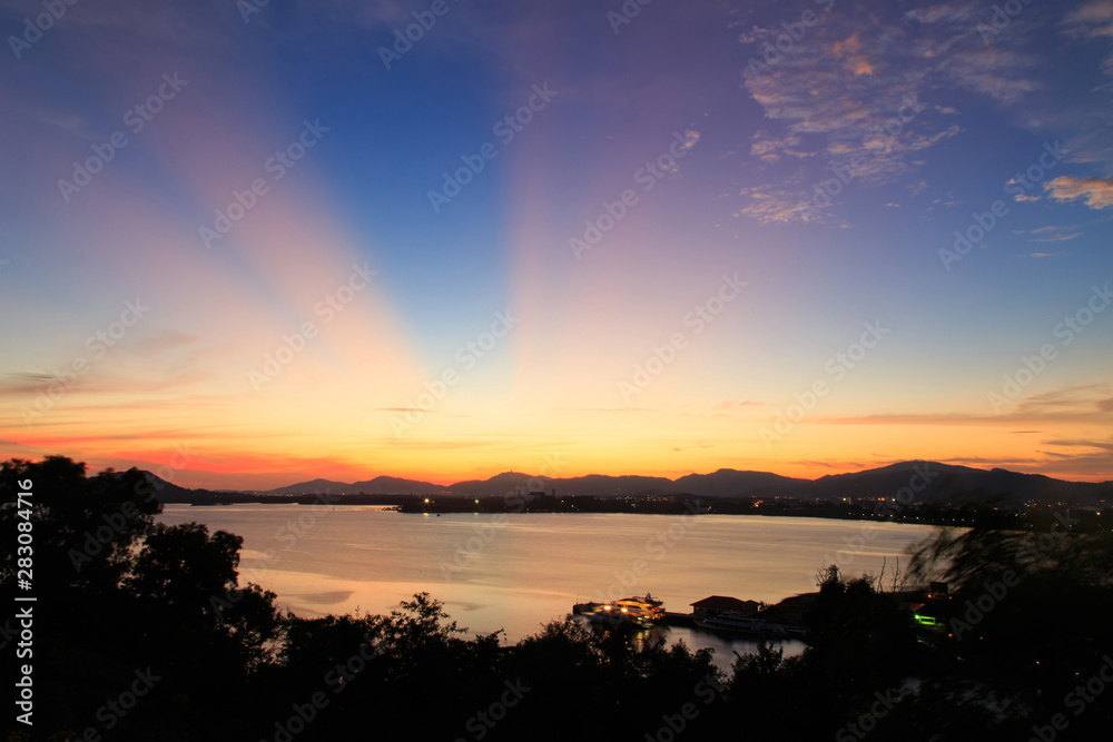 Vibrant and colorful purple sunset with silhouette of mountains/Colorful sunset behind mountains of tropical island/Sky after sunset a beautiful colorful/Beautiful twilight sky and landscape/ Vibrant and colorful purple sunset with silhouette of mountains/Colorful sunset behind mountains of tropical island/Sky after sunset a beautiful colorful/Beautiful twilight sky and landscape/