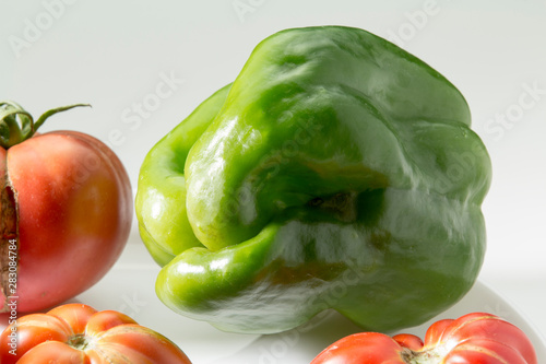 Ugly freak organic pepperon a white background. The concept of organic vegetables. photo