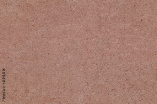 Full frame image of textured stucco in terracotta color. High resolution seamless texture of plaster for 3d models, background, pattern, poster, collage, gift wrap, wallpaper etc. photo