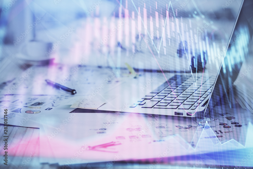 Forex Chart hologram on table with computer background. Multi exposure. Concept of financial markets. Forex Chart hologram on table with computer background. Multi exposure. Concept of financial markets.
