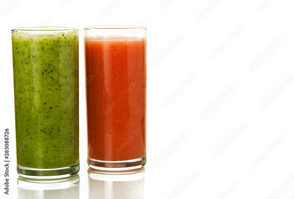 Fresh cocktail on isolate. Two glasses with vegetable cocktails. Healthy drinks.