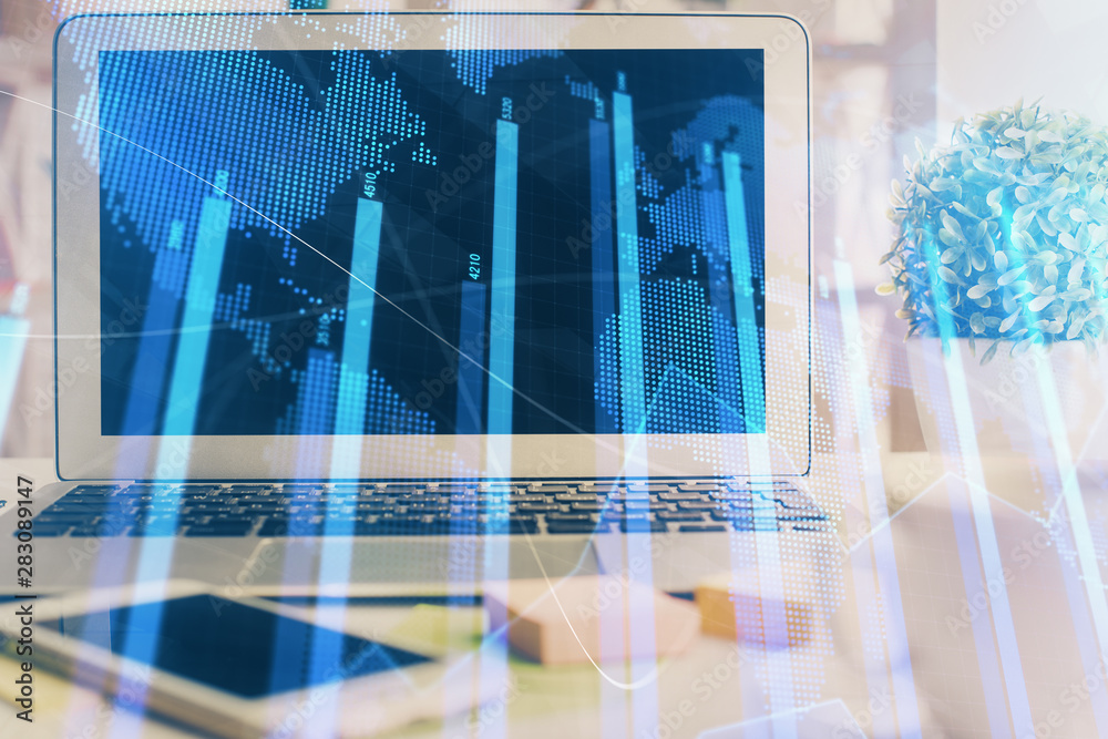 Financial market graph hologram and personal computer on background. Double exposure. Concept of forex. Financial market graph hologram and personal computer on background. Double exposure. Concept of forex.