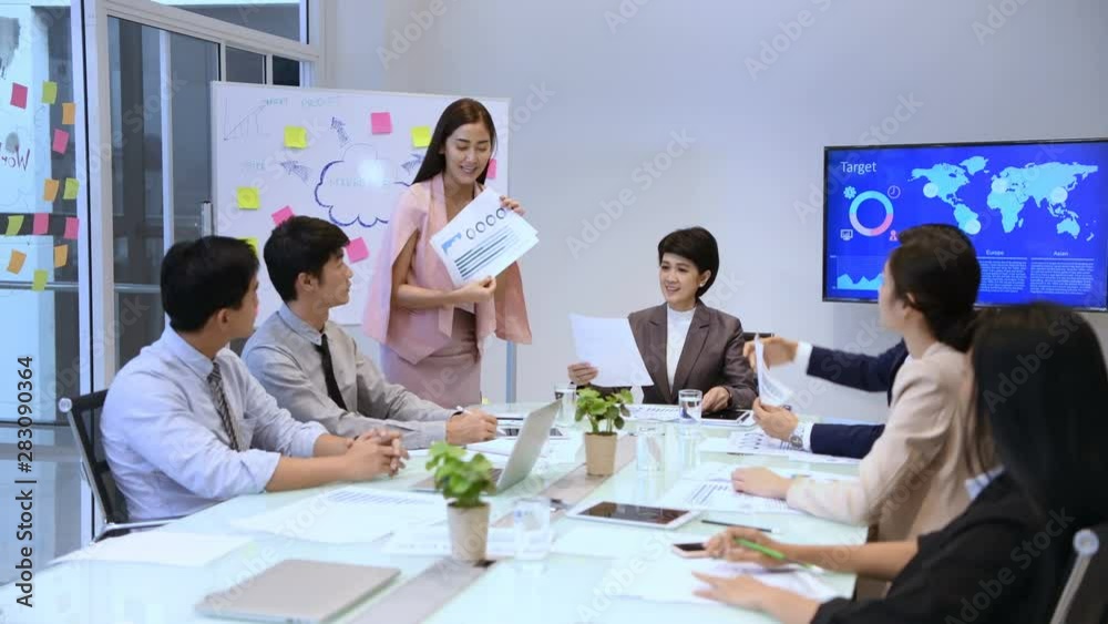Business concept. Young businessmen are distributing documents to present their work. Business concept. Young businessmen are distributing documents to present their work.