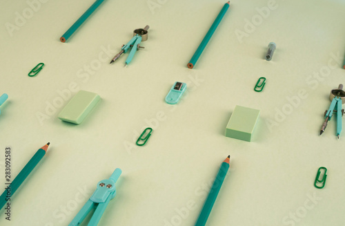 School supplies on green background, back to school