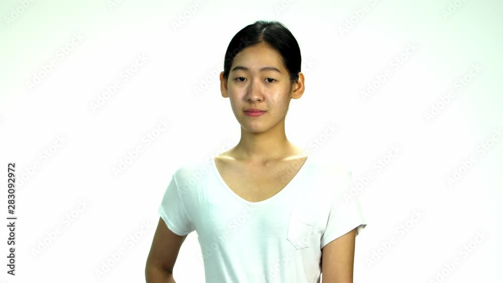 Young Asian 20s Woman black wrapped hair without cosmetic make up or fresh face look in t-shirt express emotion on white background for viral clip Casting or advertising Young Asian 20s Woman black wrapped hair without cosmetic make up or fresh face look in t-shirt express emotion on white background for viral clip Casting or advertising