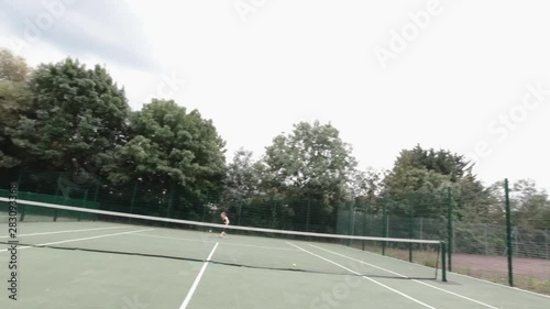 Wallpaper Mural Point of view shot of amateur tennis player playing in park with female player Torontodigital.ca