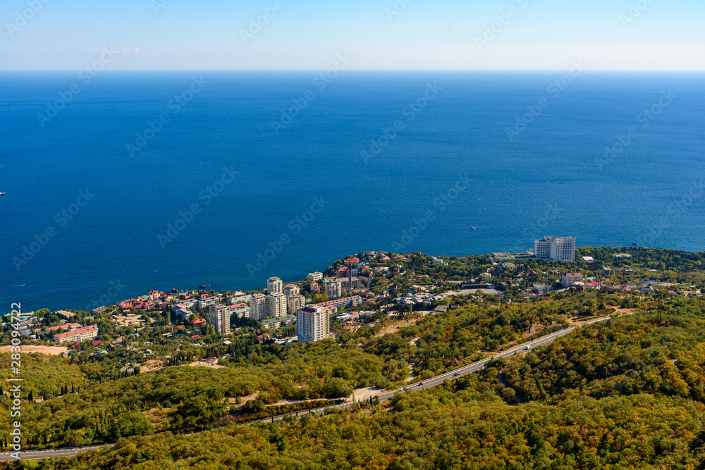 view of the Black Sea city of Foros from the height of the mountain, on a bright sunny cloudless day.