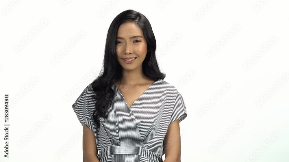 Young Asian 20s Woman black curl smooth hair cosmetic make up pretty face look in white strip shirt express emotion on white background for viral clip Casting or advertising Young Asian 20s Woman black curl smooth hair cosmetic make up pretty face look in white strip shirt express emotion on white background for viral clip Casting or advertising