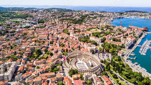 Pula aerial drone shot of The Arena is the only remaining Roman amphitheatre to have four side towers and with all three Roman architectural orders entirely preserved.
