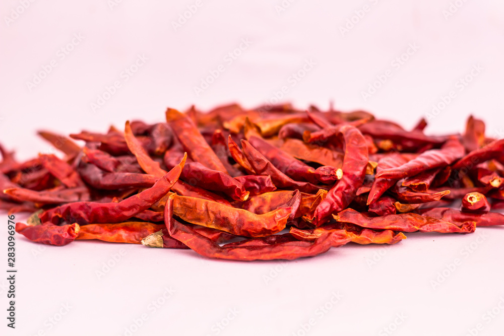 Fototapeta premium Dried red chili or chilli cayenne pepper isolated on white background