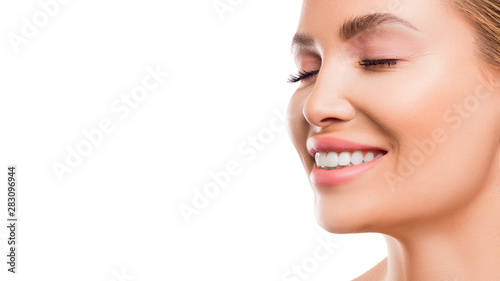 Close up portrait of a smiling woman.
