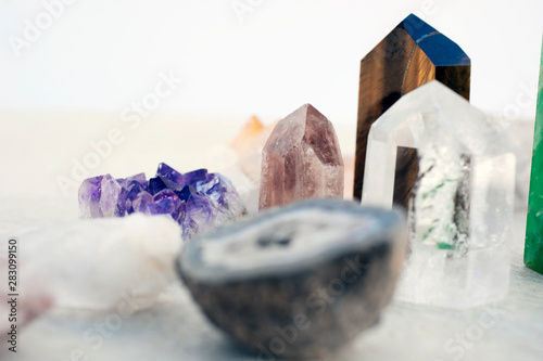 A collection of stone crystals for healing and energy meditation.  photo