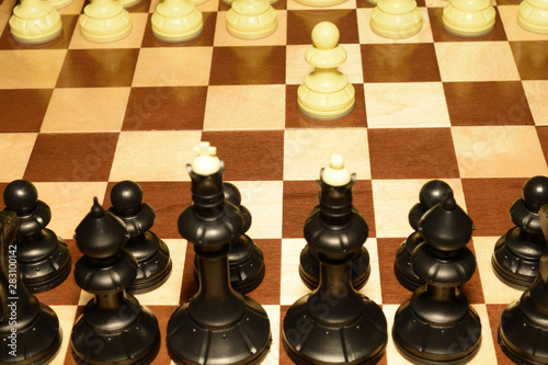 Chechered board with the pawns as a game theme