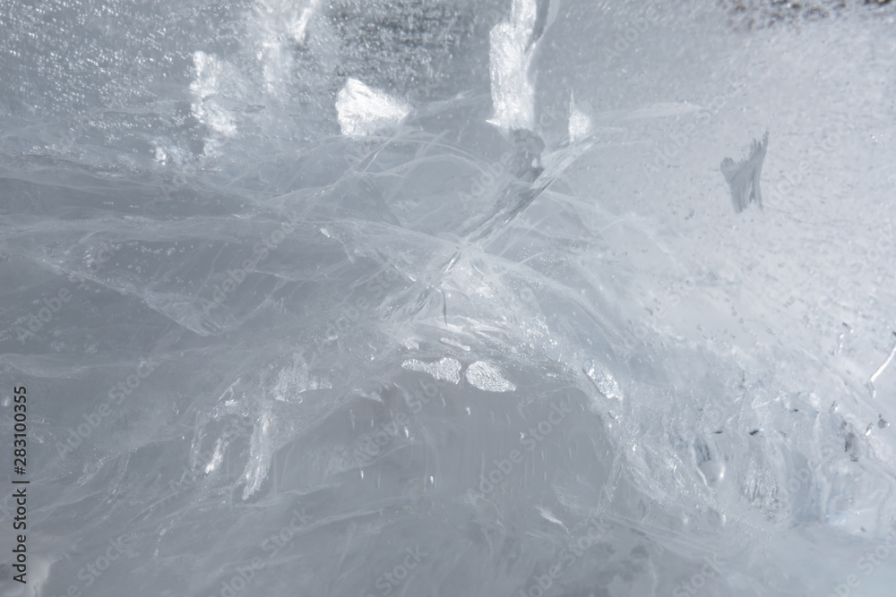 Winter cold crakled ice background texture