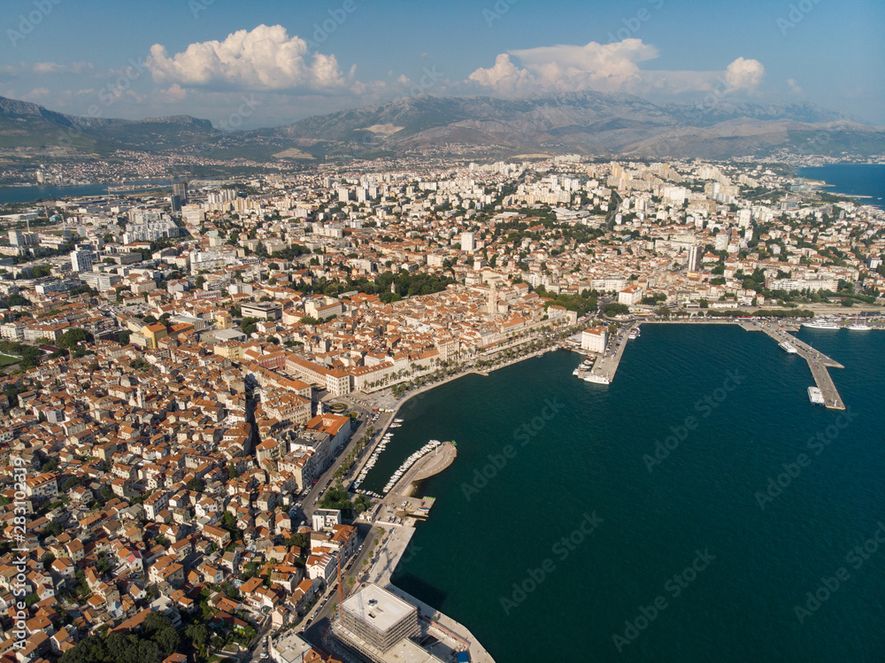 Fototapeta premium Split, Croatia, august 2019: Aerial view of Split city, Diocletian Palace and Mosor mountains in background. Split panoramic view of town, UNESCO World Heritage