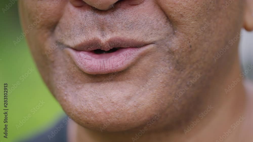 Close up of male mouth talking to camera Close up of male mouth talking to camera