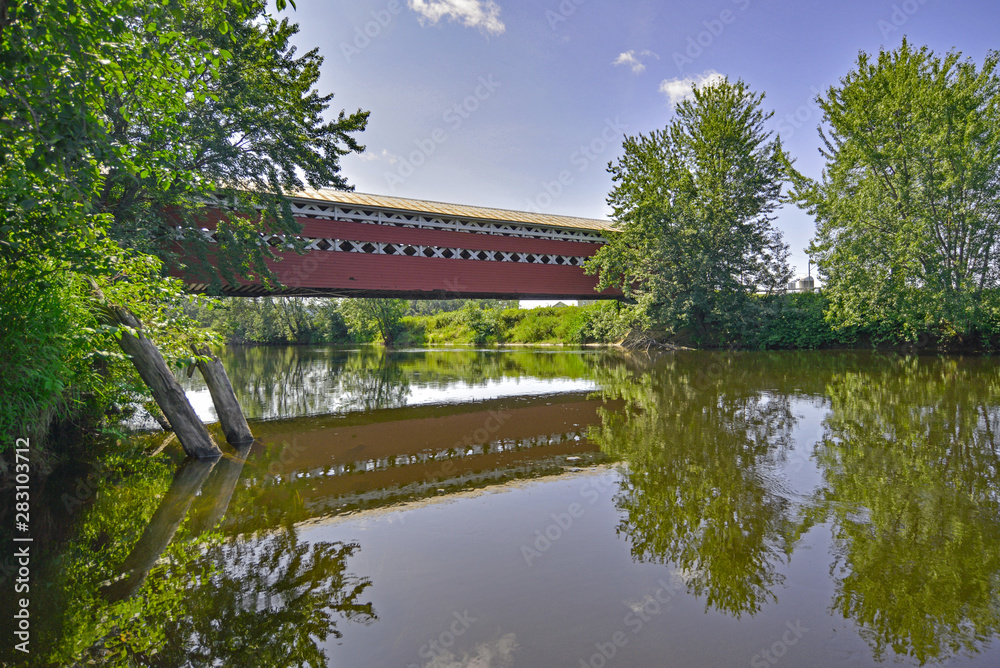 Fototapeta premium Prud'homme bridge seen from the river, Mont-Tremblant, Quebec, C
